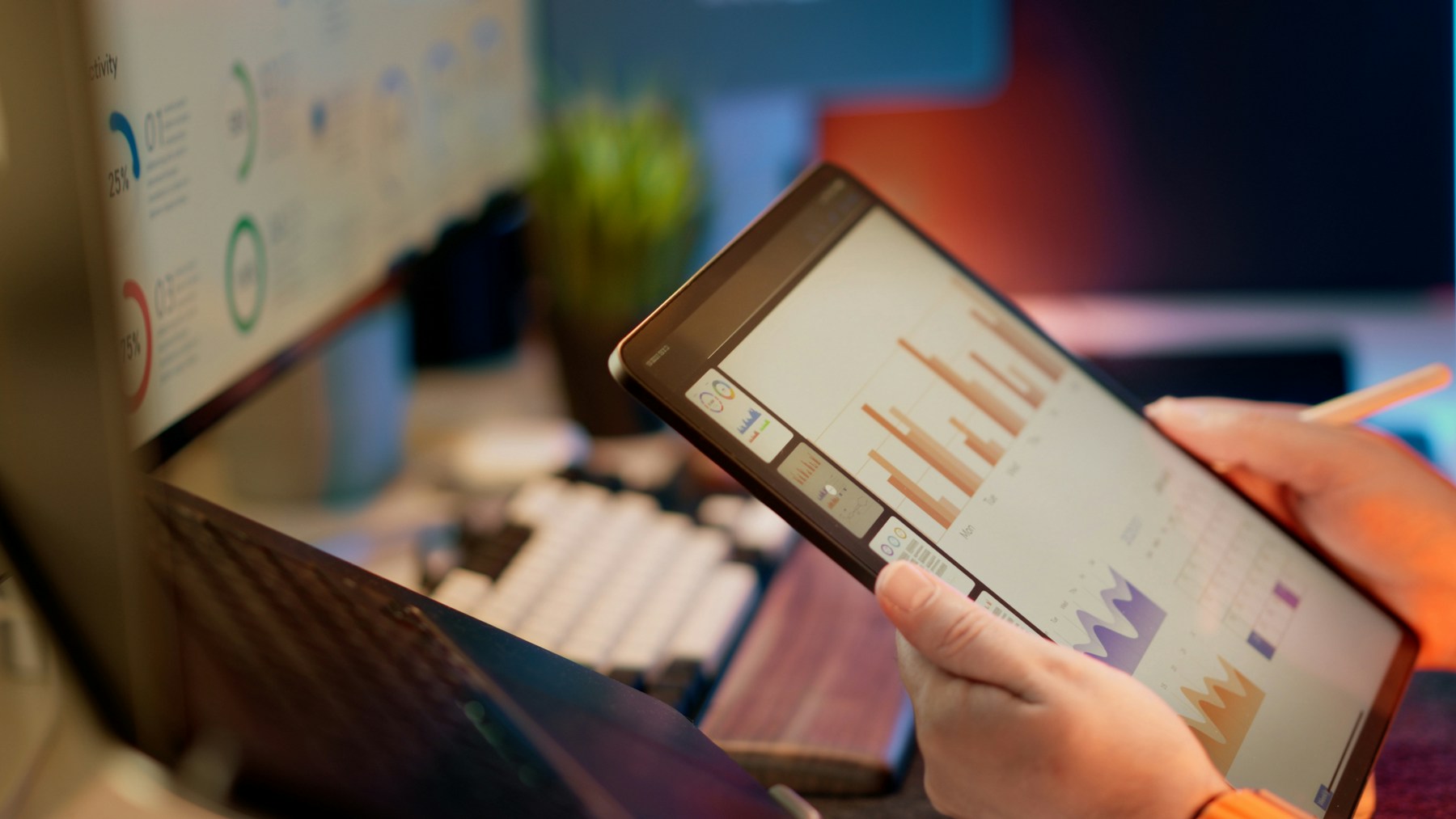 Analyst reviewing payment performance dashboards on a tablet